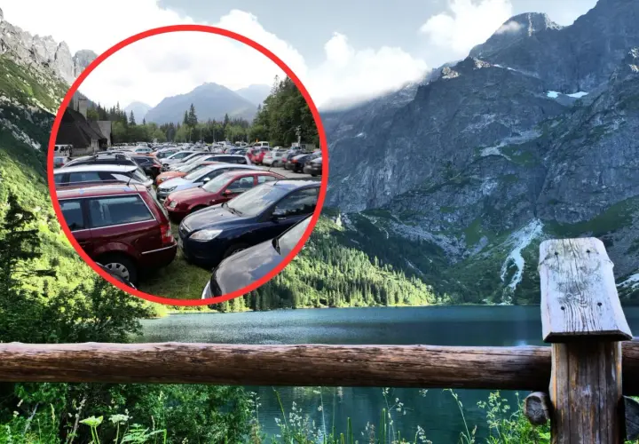Tłok samochodów na parkingu pod Morskim Okiem. W tle piękne góry i jezioro.